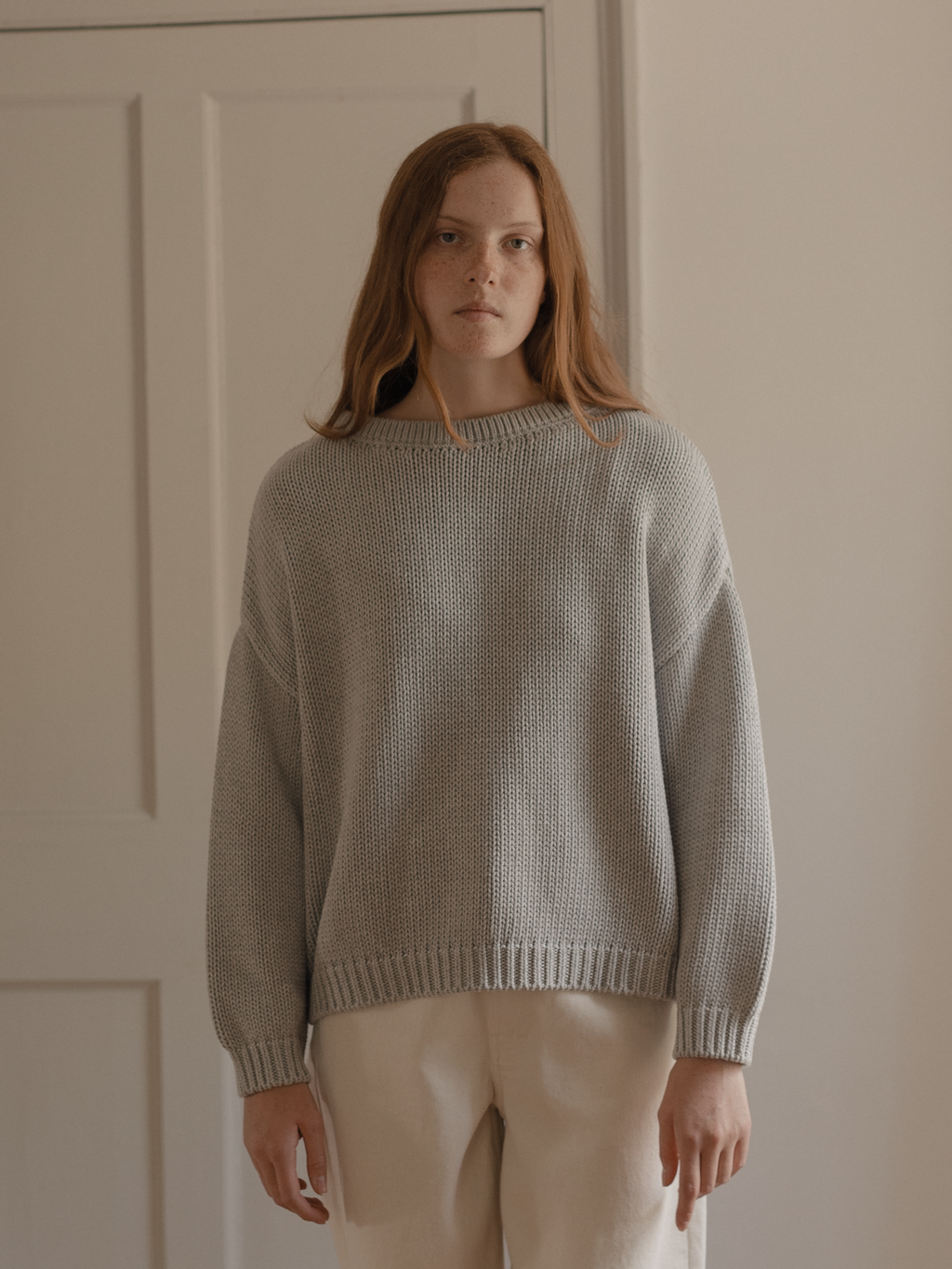 Model wearing the Townes Pullover in Pebble by Gillian Stevens, front view showing chunky knit texture