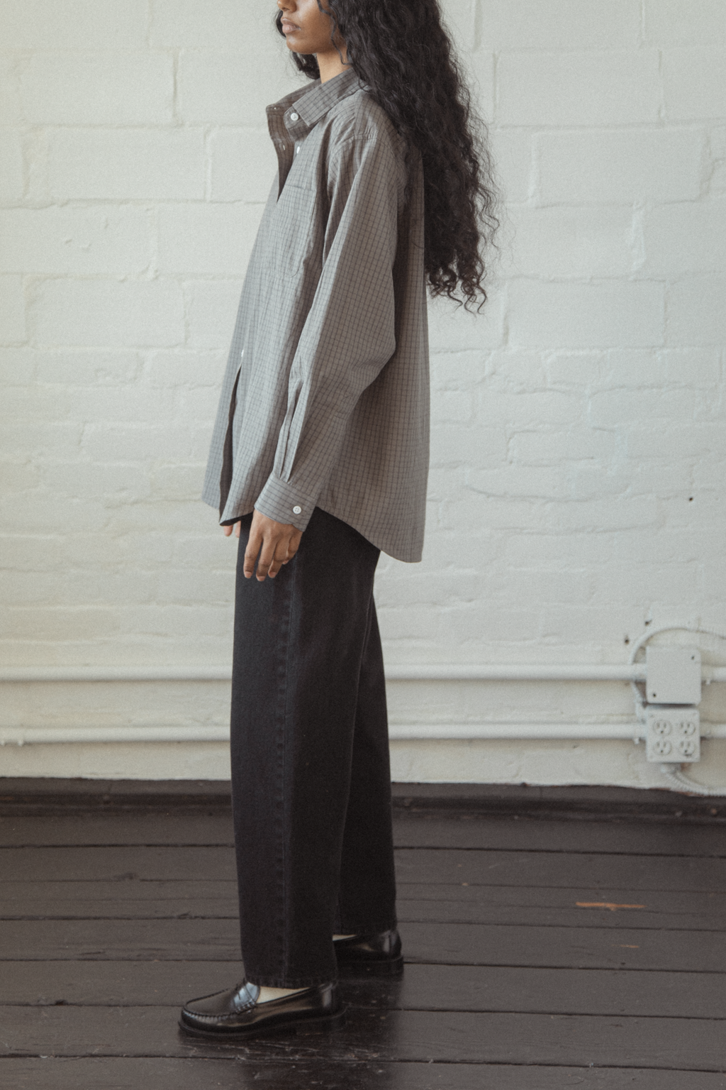 Model wearing the Dara Jean in Noir by Gillian Stevens, side view showing wide-leg silhouette