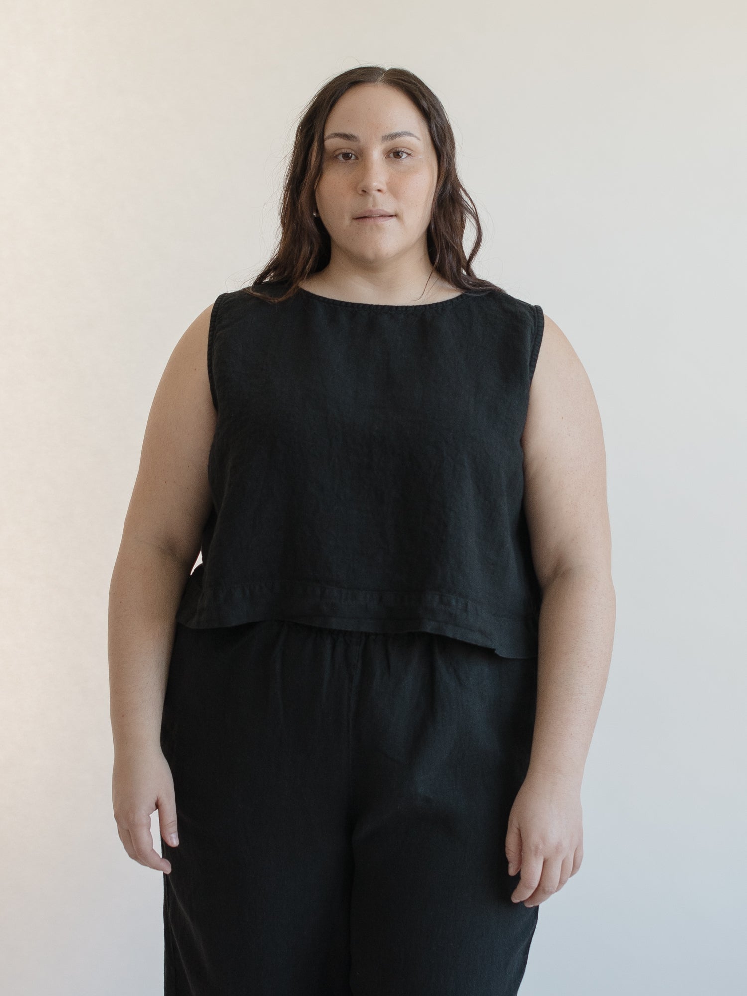 Model wearing the Finley Top in Noir by Gillian Stevens, front view showing cropped silhouette