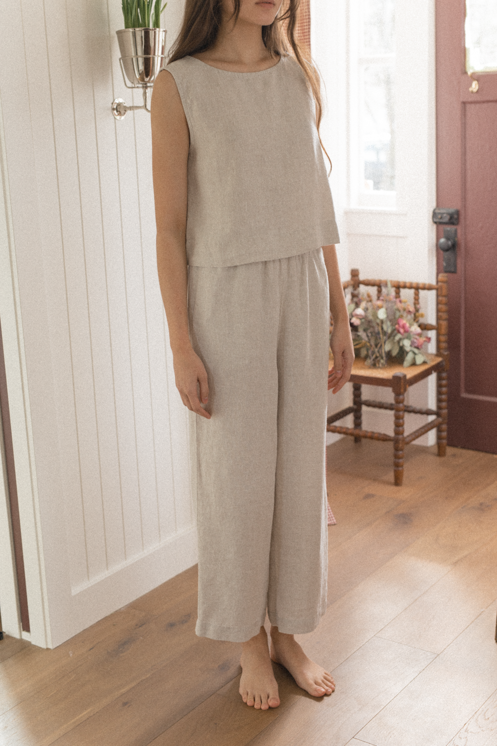 Model wearing the Finley Pant in Oatmeal by Gillian Stevens, front view styled with matching sleeveless top