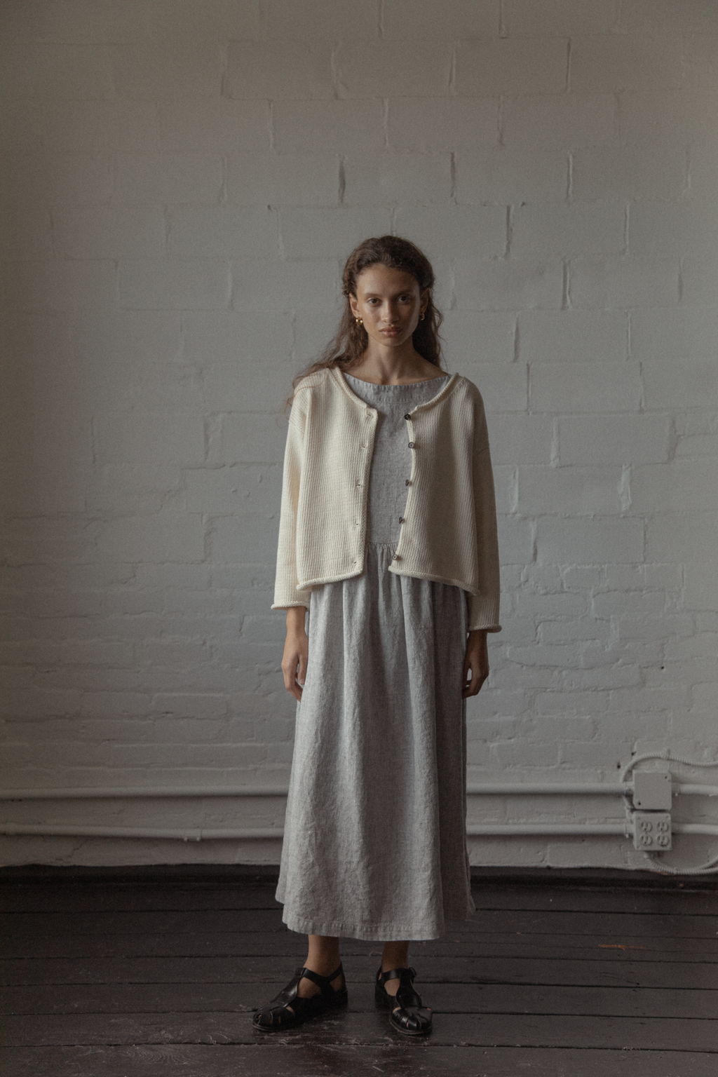 Model wearing the Lennon Cardigan in Ivory by Gillian Stevens, full-length front view