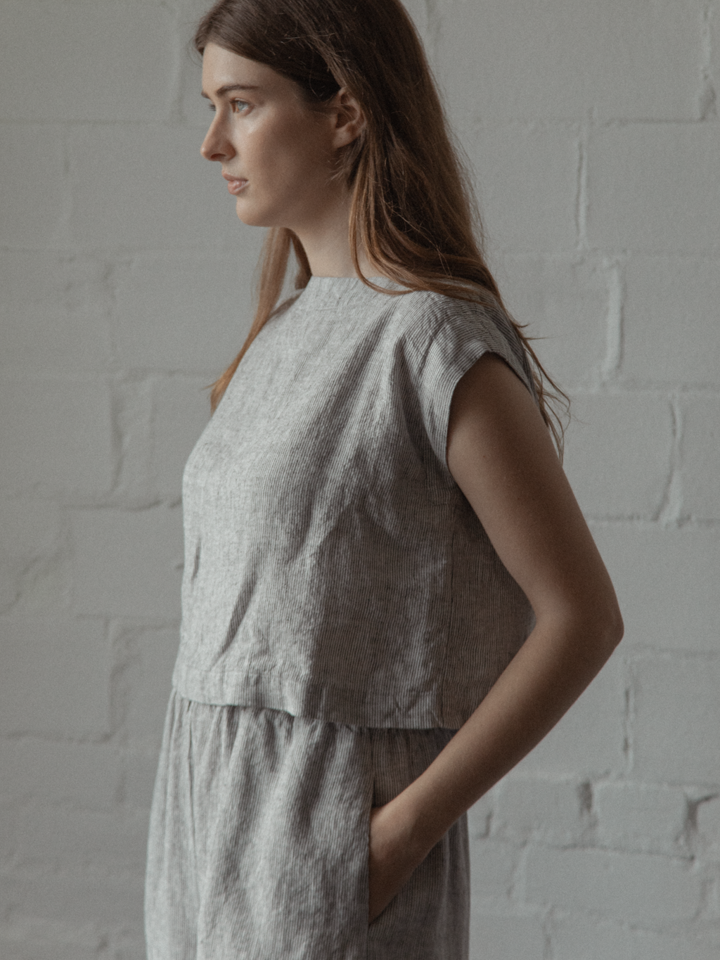 Model wearing the Valley Top in Charcoal Stripe by Gillian Stevens