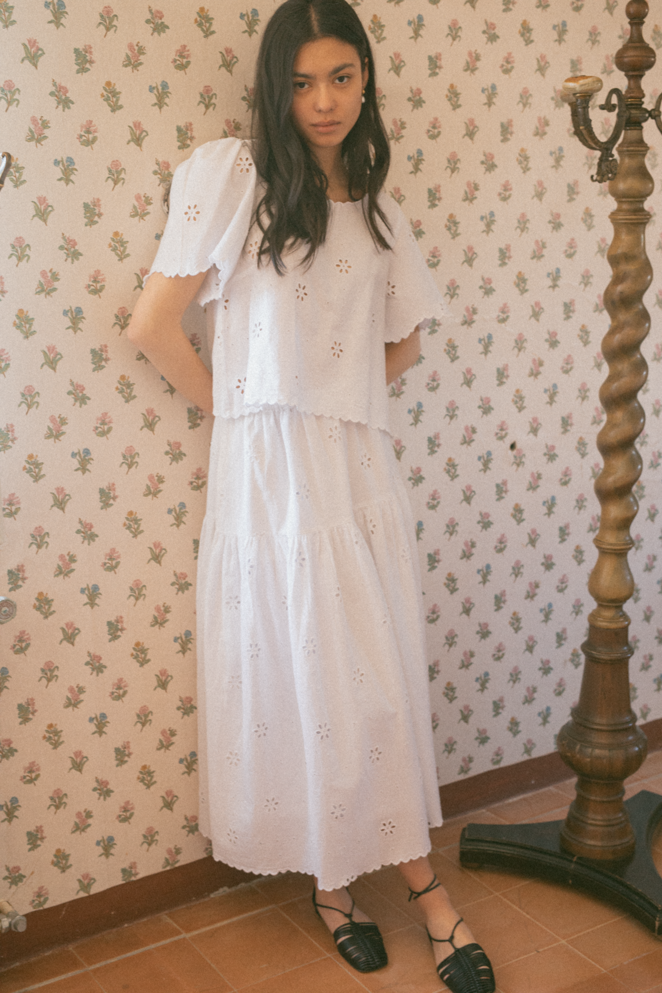 Model wearing the Stella Skirt in Salt by Gillian Stevens, styled with matching eyelet top, front view