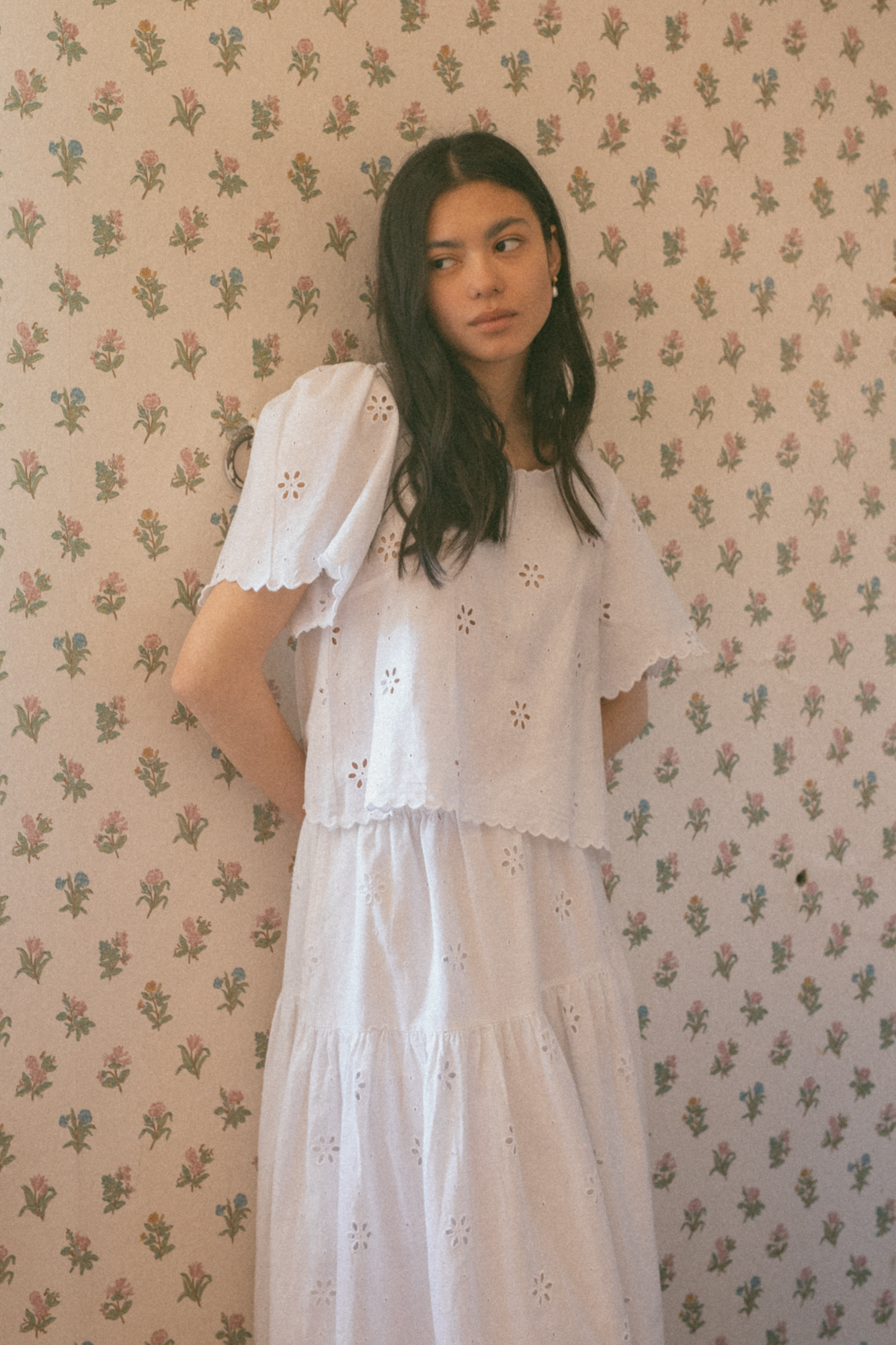 Model wearing the Stella Top in Salt by Gillian Stevens, front view showing broderie anglaise detail