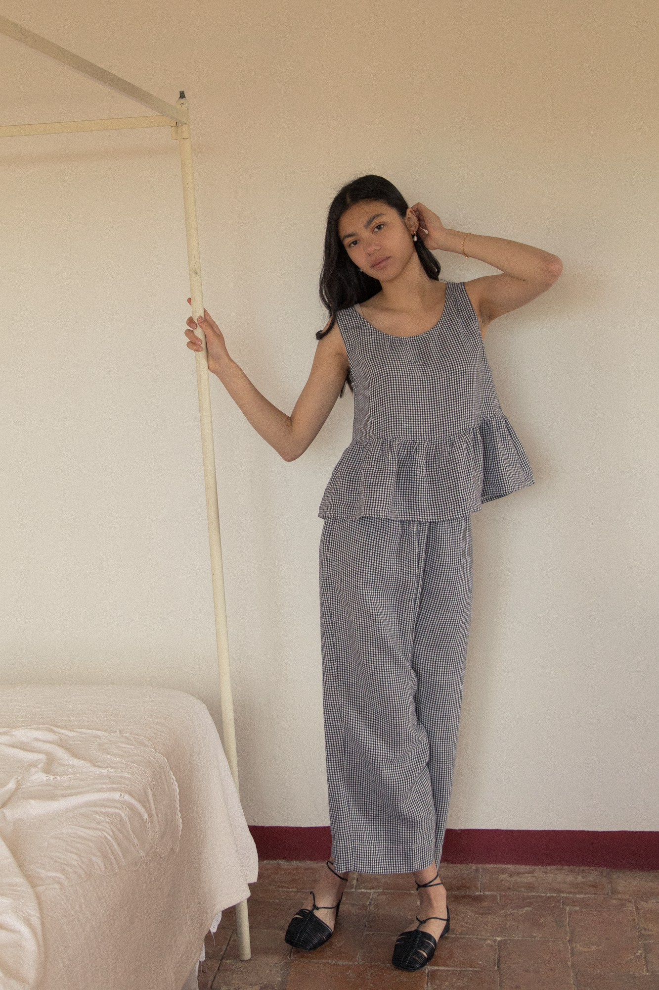 Model wearing the Marlowe Top in Marine Gingham by Gillian Stevens, full-length front view styled with matching pants