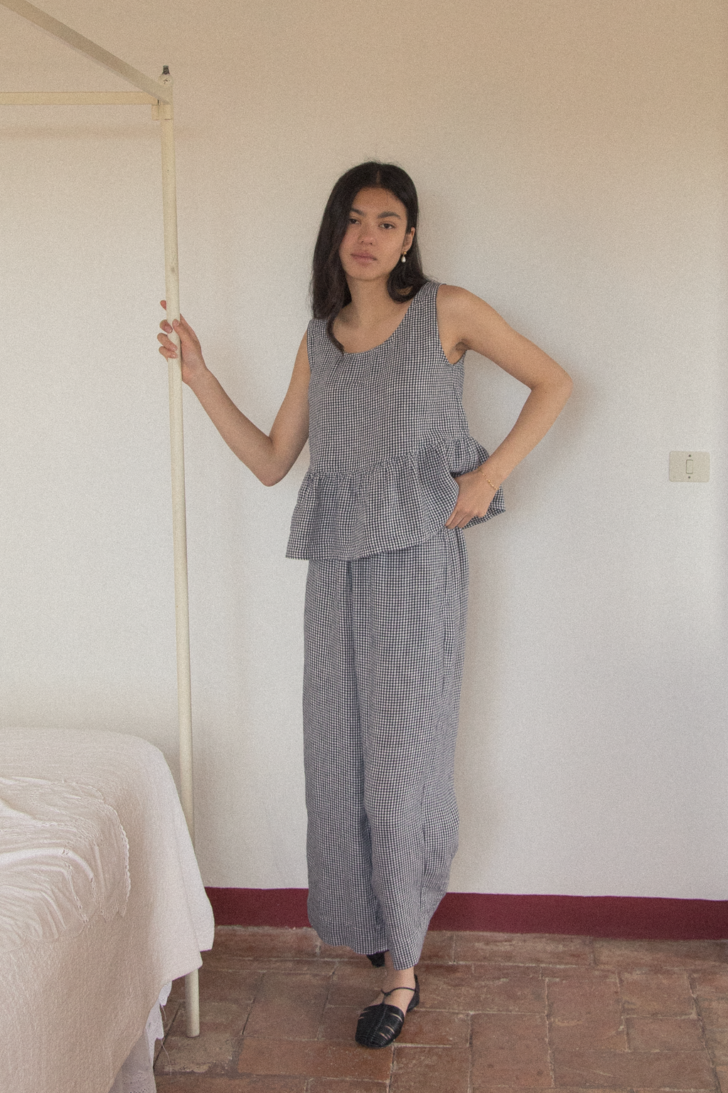 Model wearing the Olive Pant in Marine Gingham by Gillian Stevens, full-length front view