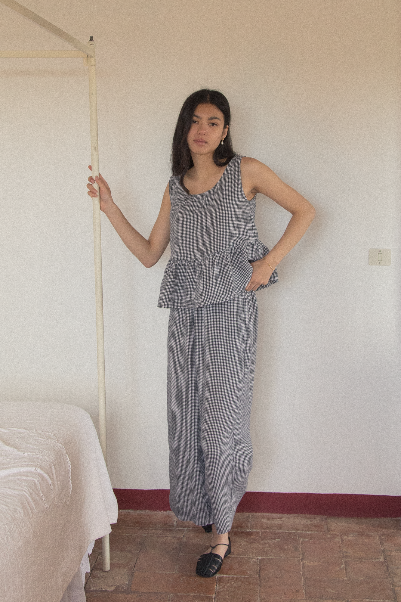 Model wearing the Olive Pant in Marine Gingham by Gillian Stevens, full-length front view
