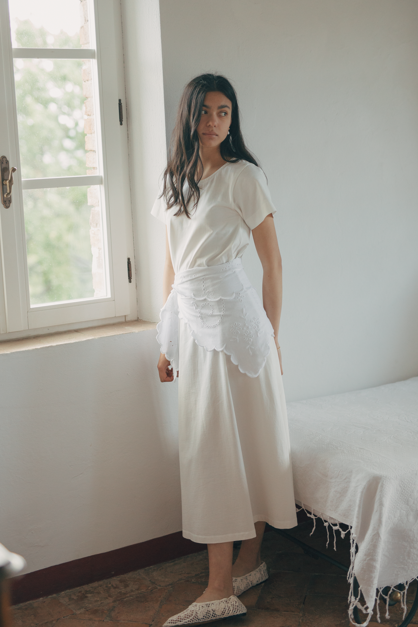 Model wearing the Matilde Scarf in Salt by Gillian Stevens, tied at the waist over a cream midi dress