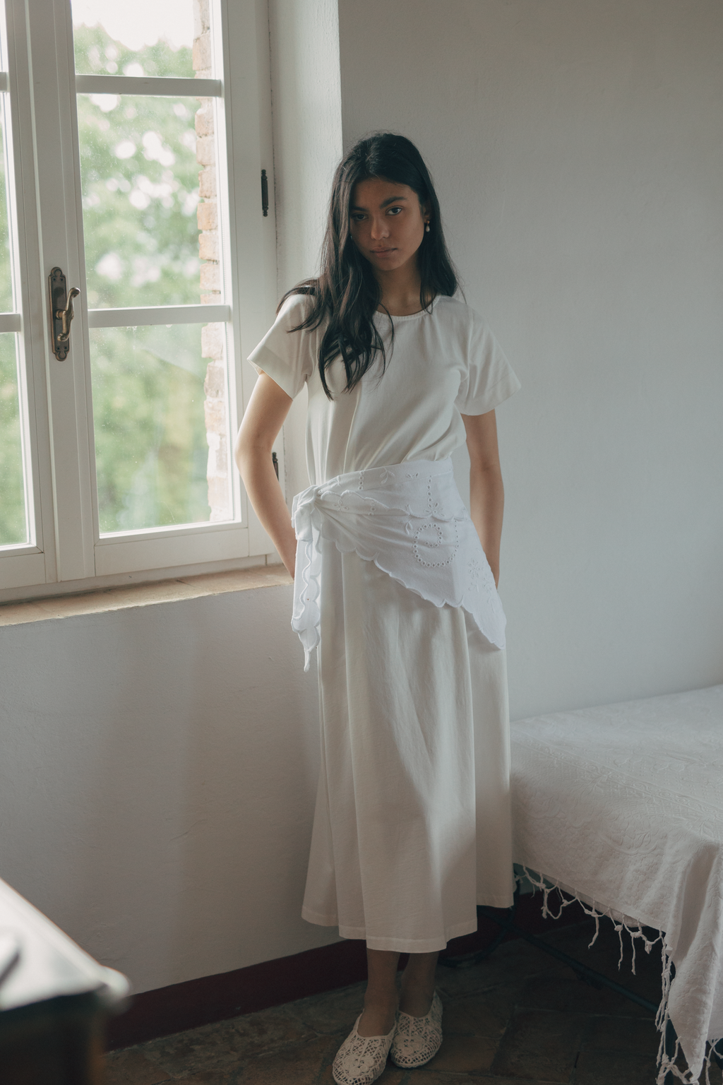 Model wearing the Matilde Scarf in Salt by Gillian Stevens, tied at the waist over a cream midi dress