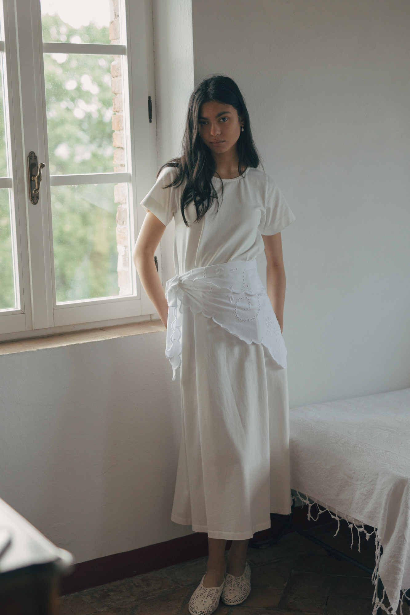 Model wearing the Matilde Scarf in Salt by Gillian Stevens, tied at the waist over a cream midi dress