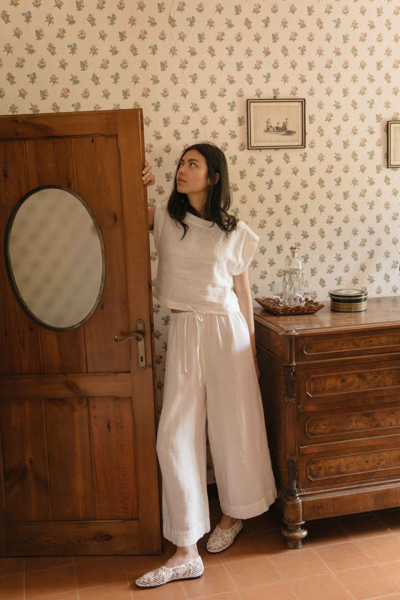 Model wearing the Ines Pant in Salt by Gillian Stevens, full-length front view in a vintage room setting