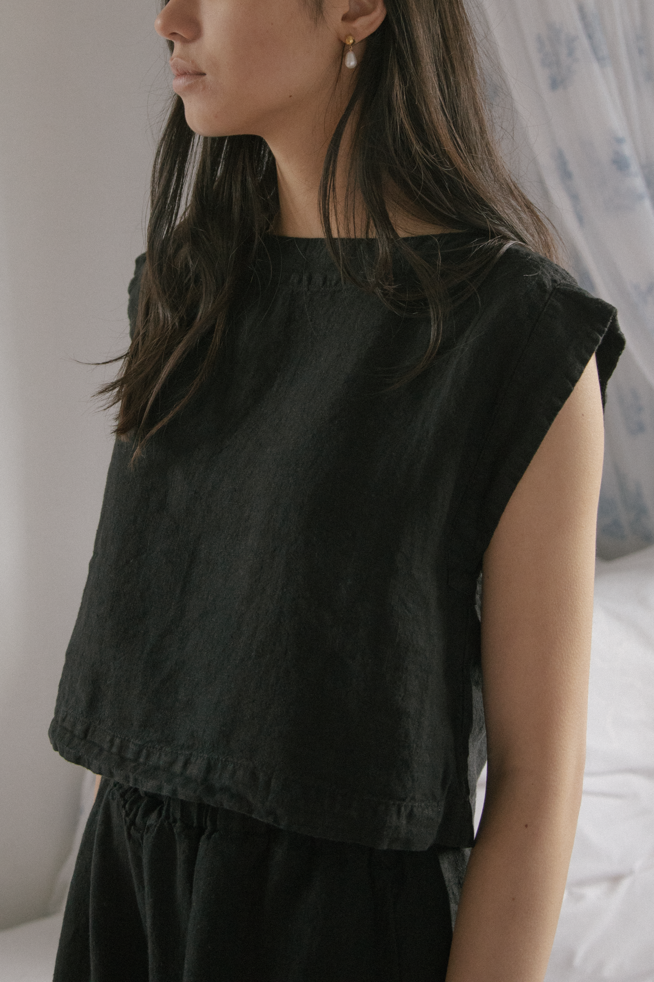 Model wearing the Valley Top in Noir by Gillian Stevens, front view showing square neck and cap sleeves