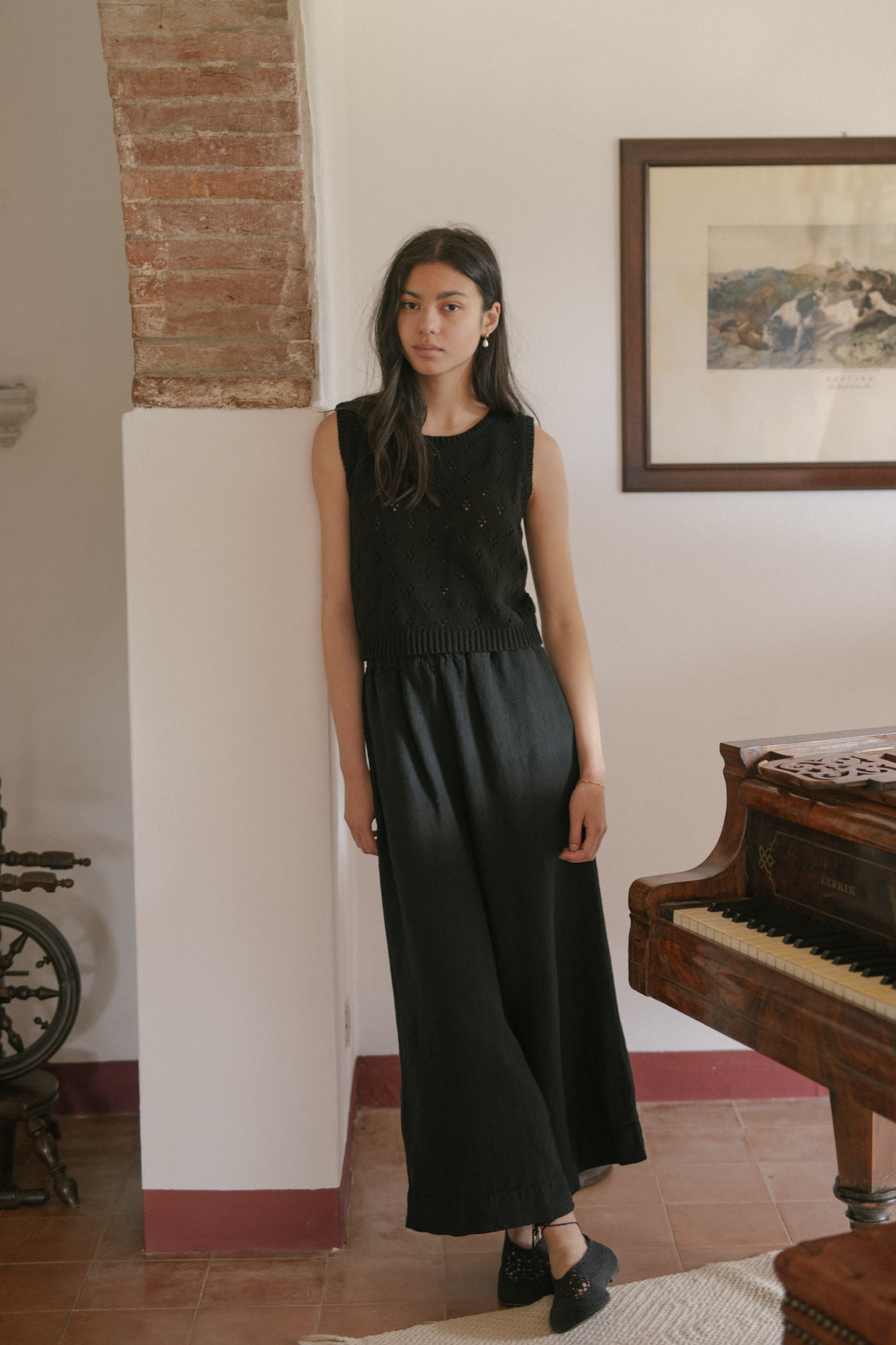 Model wearing the Niah Top in Noir by Gillian Stevens, front view showing pointelle knit detail