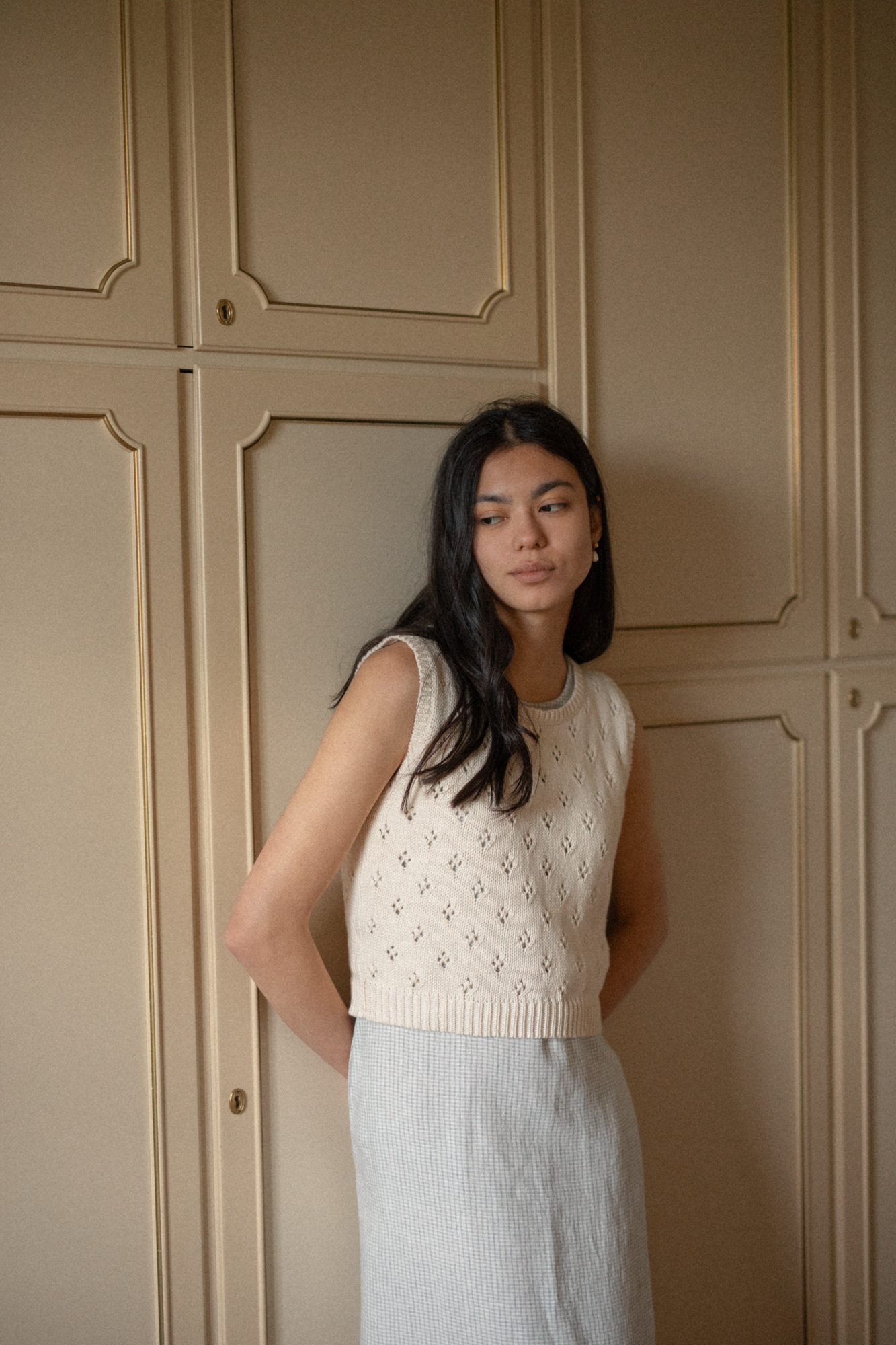 Model wearing the Niah Top in Ivory by Gillian Stevens, front view showing pointelle knit detail