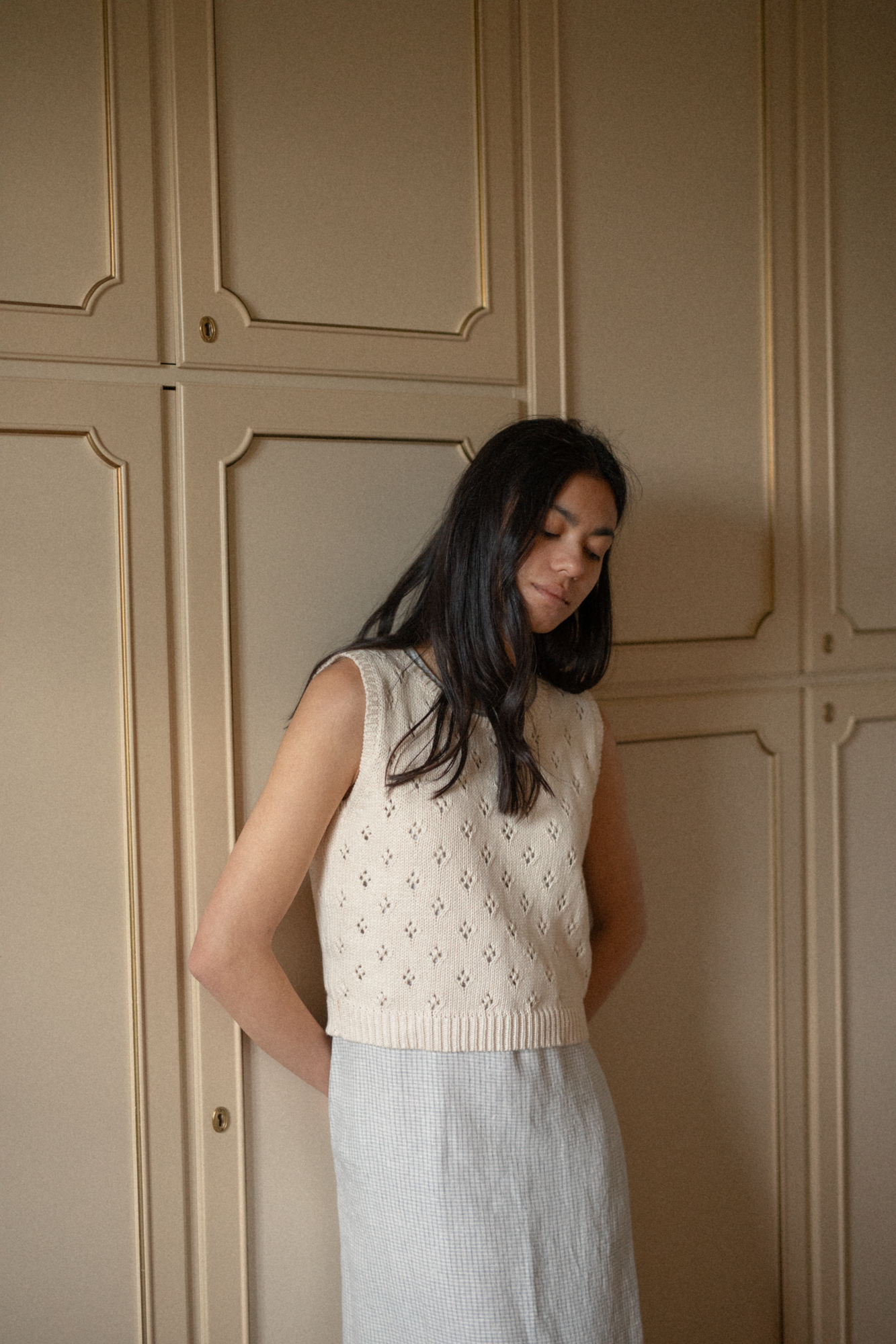 Model wearing the Niah Top in Ivory by Gillian Stevens, front view showing pointelle knit detail