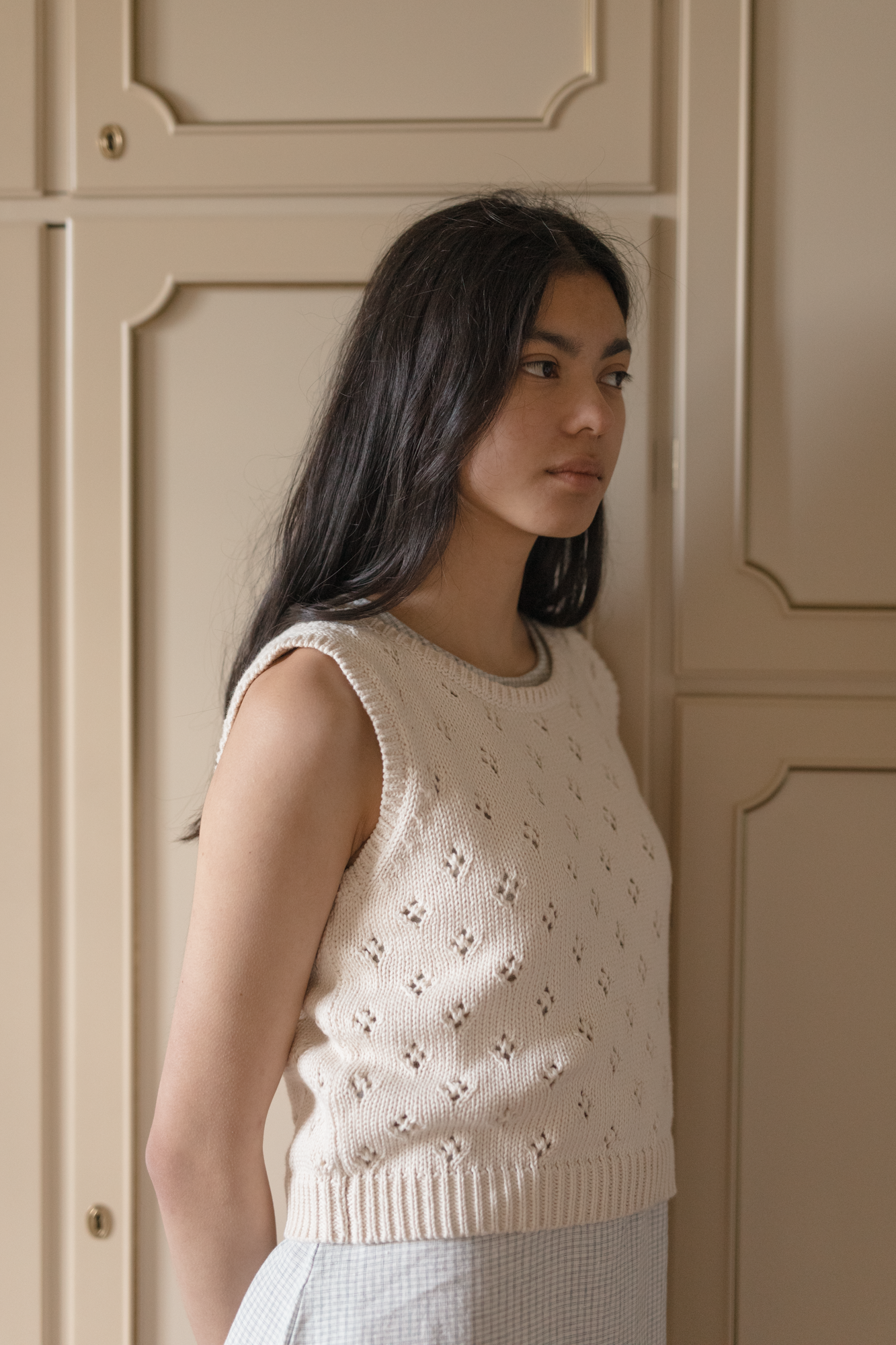 Model wearing the Niah Top in Ivory by Gillian Stevens, front view showing pointelle knit detail