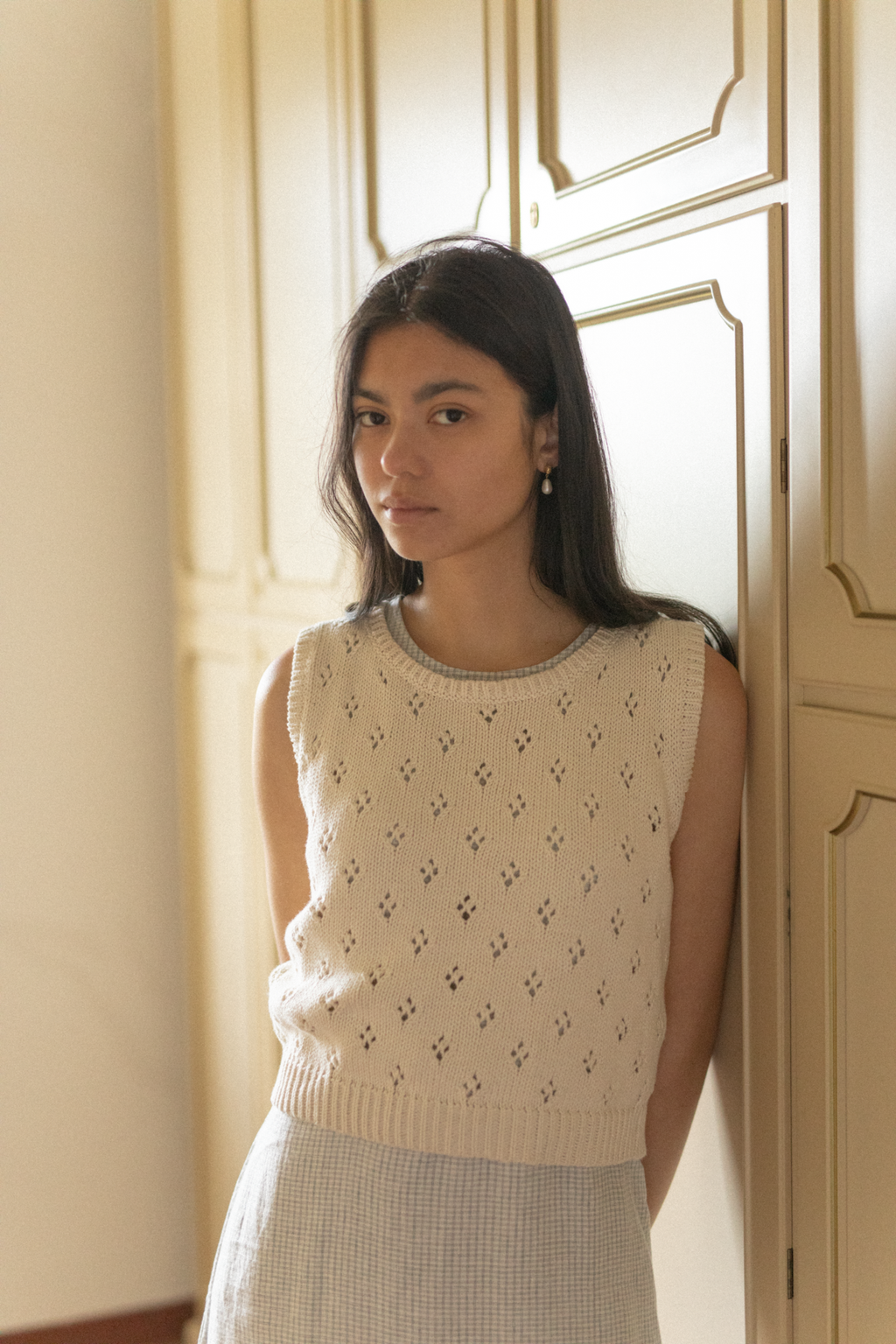 Model wearing the Niah Top in Ivory by Gillian Stevens, front view showing pointelle knit detail