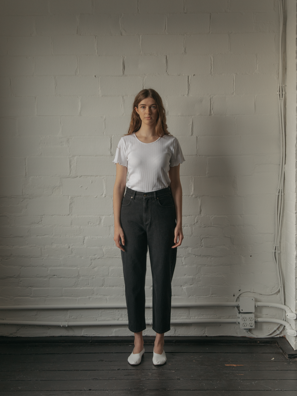 Model wearing the Dara Jean in Noir by Gillian Stevens, full-length front view