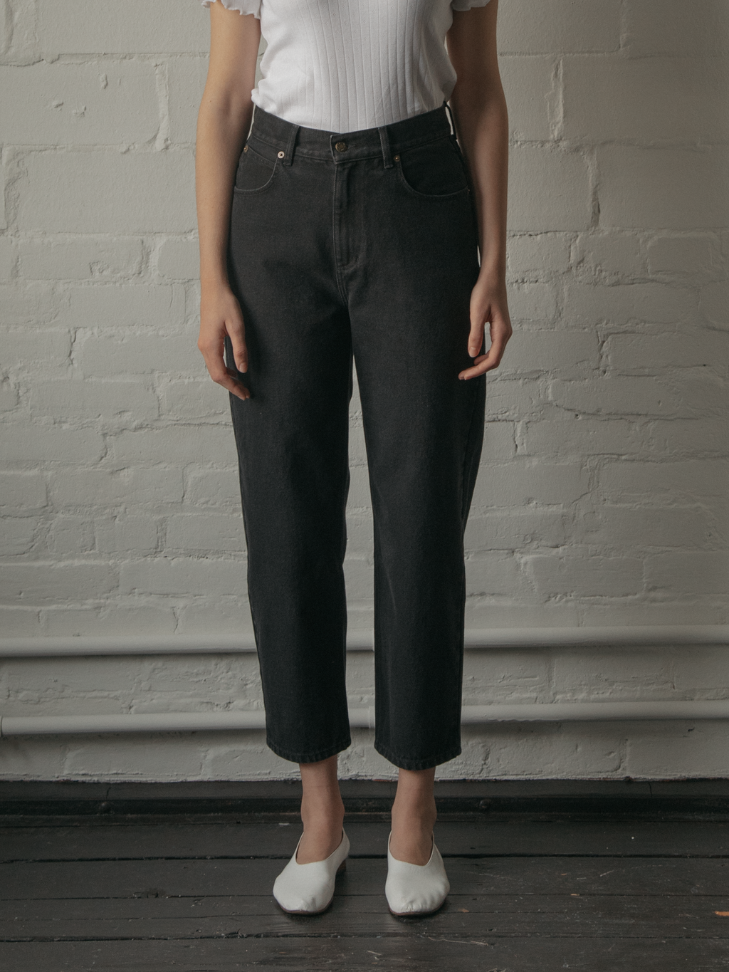 Model wearing the Dara Jean in Noir by Gillian Stevens, front view showing high waist and cropped leg