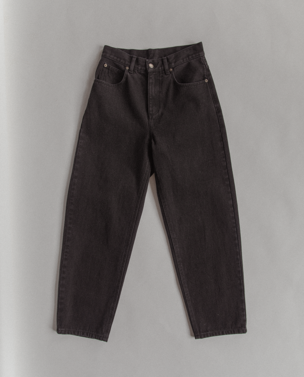 The Dara Jean in Noir by Gillian Stevens, flat-lay front view showing tapered leg and pocket detail